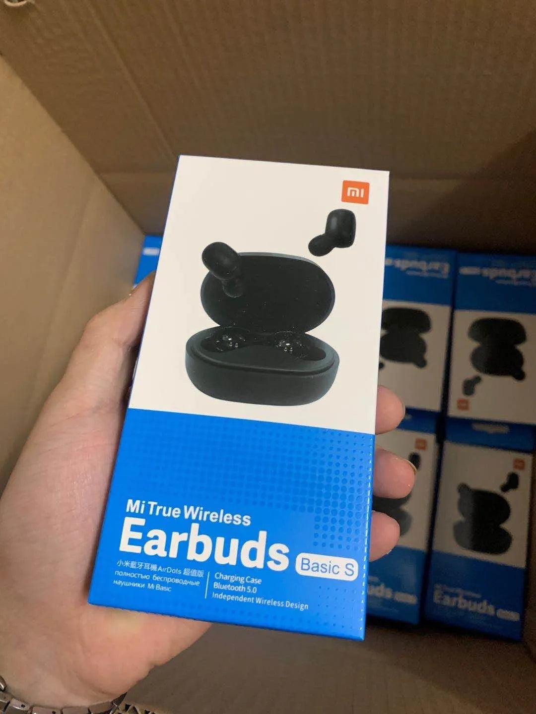 Redmi AirDots black true wireless earbuds with charging case.