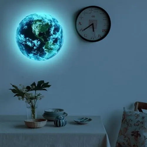 Glow in the dark 3D planet Earth wall sticker in 30cm diameter on a dark blue wall.