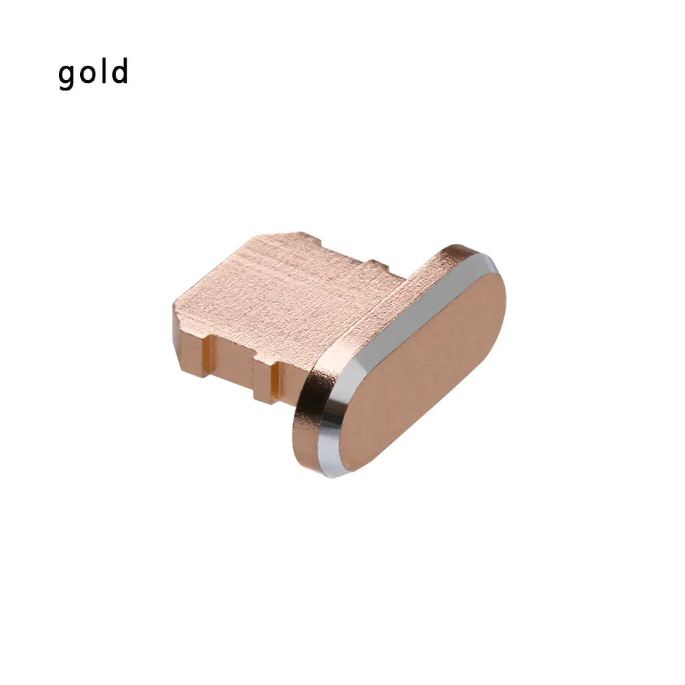 Aluminium alloy iPhone charging port dust plug in metallic colours on a dark background.