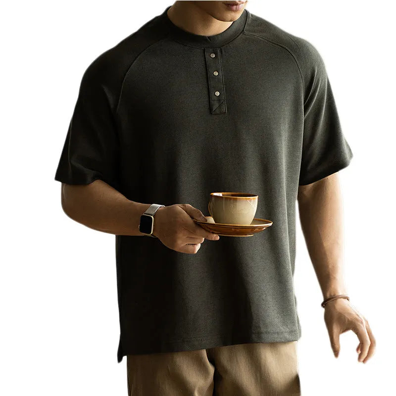 Casual loose-fitting pullover top with raglan sleeves in terry texture fabric shown in smoky grey colour