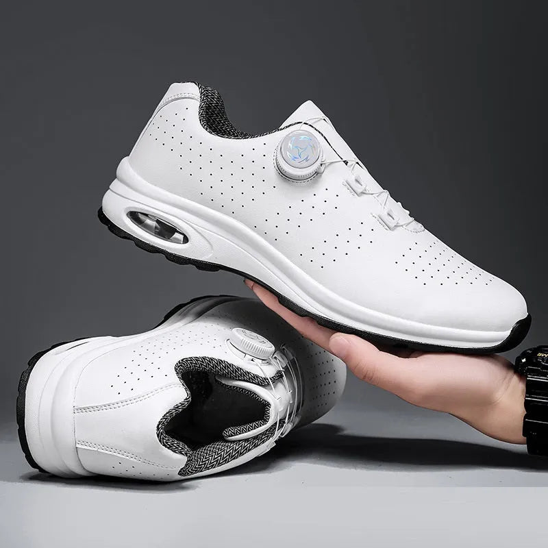Black and white low top mesh casual shoes with cross shoulder straps and lace-up front.