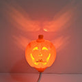 USB-powered plastic pumpkin decorative lamp showing yellow or purple light option