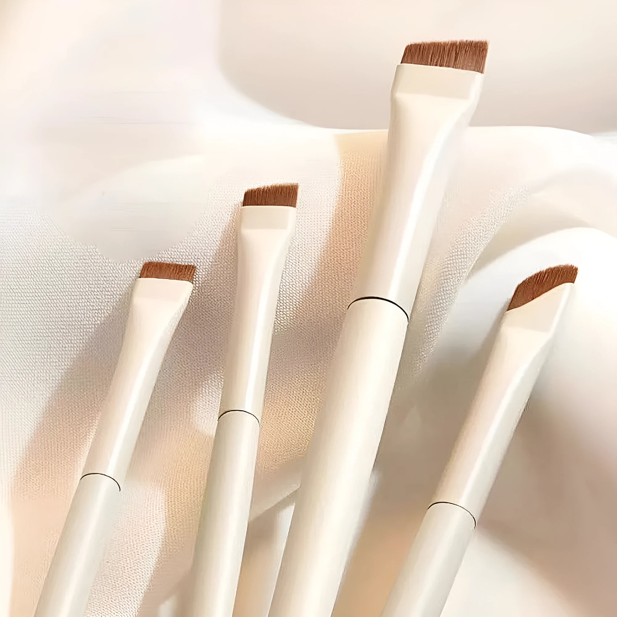 Four-piece angled eyeliner and brow brush set with ultra-thin tips and leather case for precision makeup application