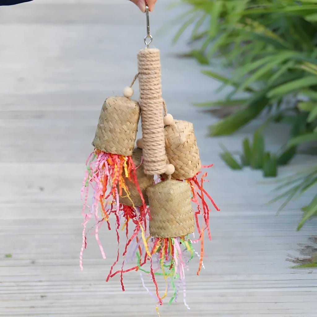 Colourful shredded paper and wood parrot hanging toy with sisal rope for medium birds.