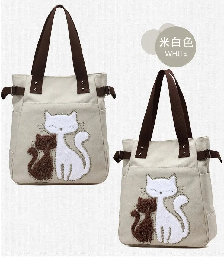 KVKY canvas handbag with plush cat applique in beige colour on a woman's shoulder