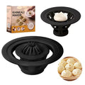 Set of four black Jinkali steamed bun and dumpling moulds on a kitchen counter