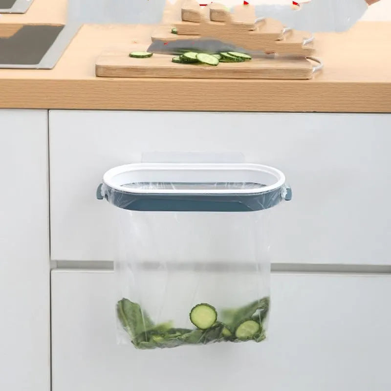 Blue plastic kitchen garbage bag storage rack mounted on cupboard door holding roll-on bin liners
