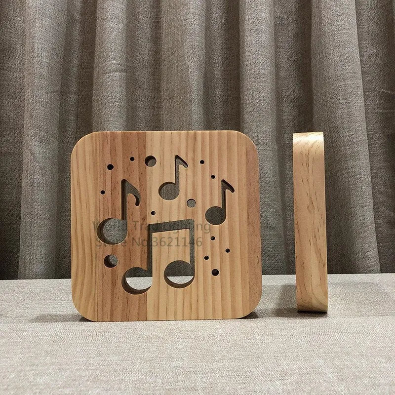 Square pine wood USB LED atmosphere lamp emitting warm white light on a desk.