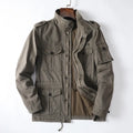 Men's loose-fit retro cotton jacket in light brown, shown with zip front closed.