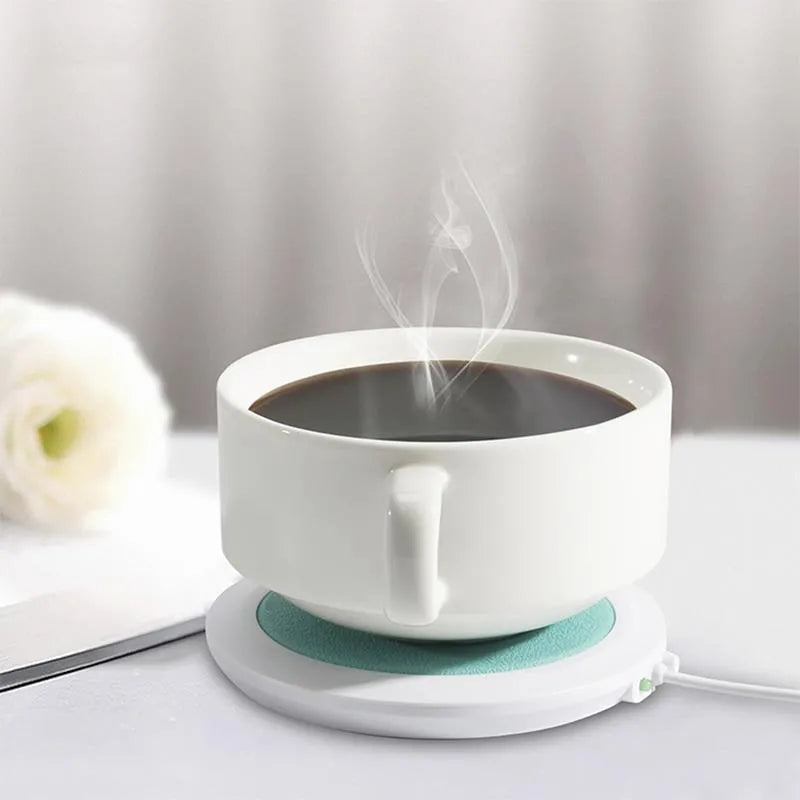 USB-powered insulated heating coaster for mugs in black, blue, and orange colour options.