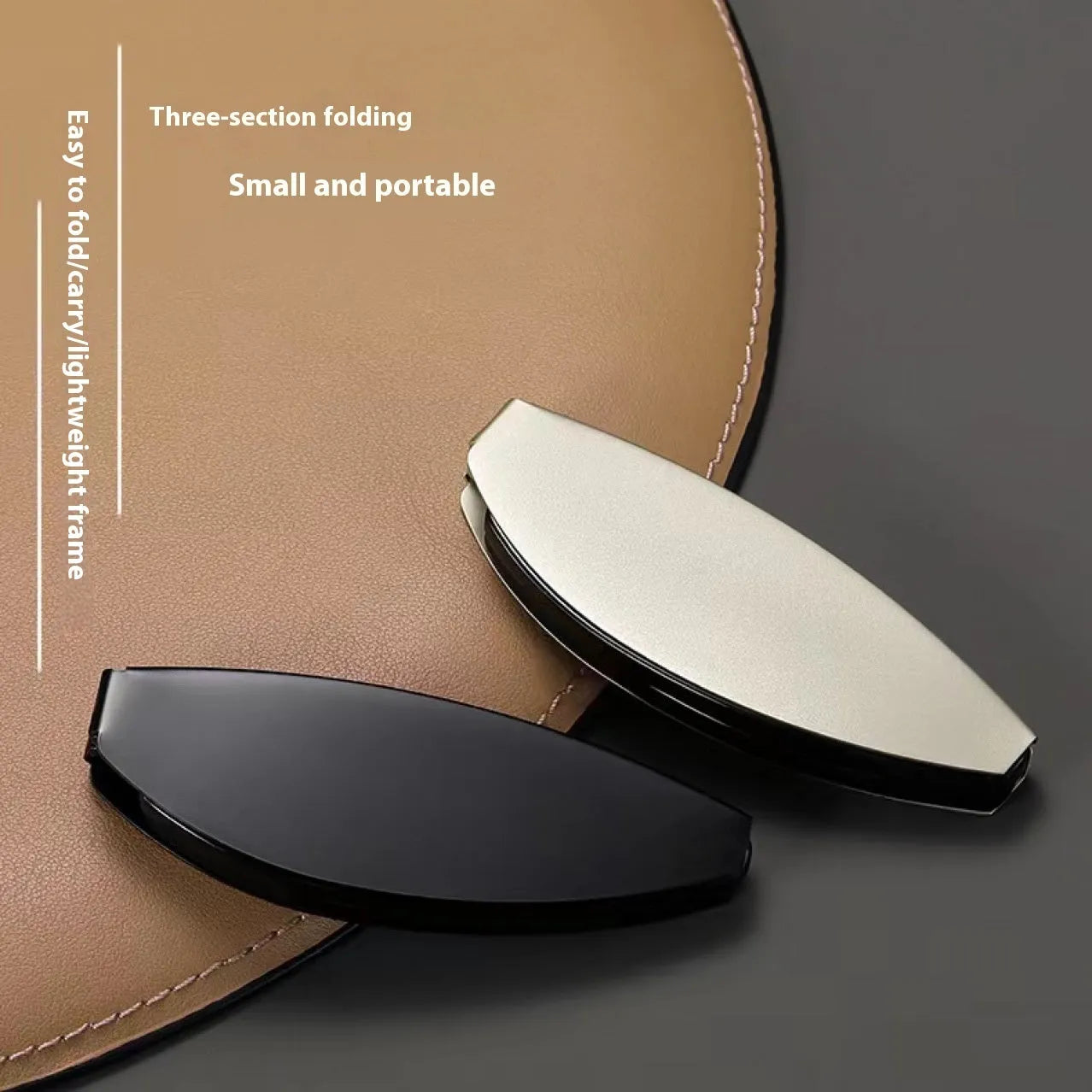 Folding reading glasses with retro metal frame in black and silver colours, showing compact folded size