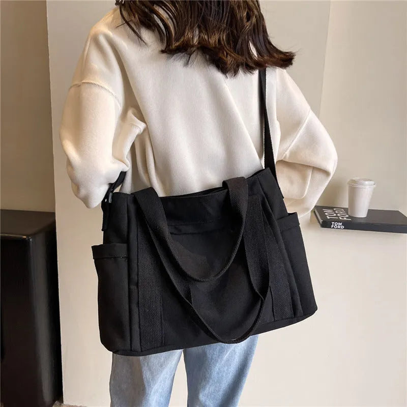 Women's solid colour shoulder bag with large capacity and mobile phone compartment in four colour options