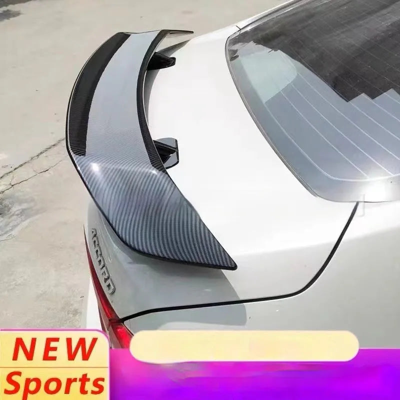 Universal punch-free car tail wing spoiler in ABS plastic shown in carbon pattern finish