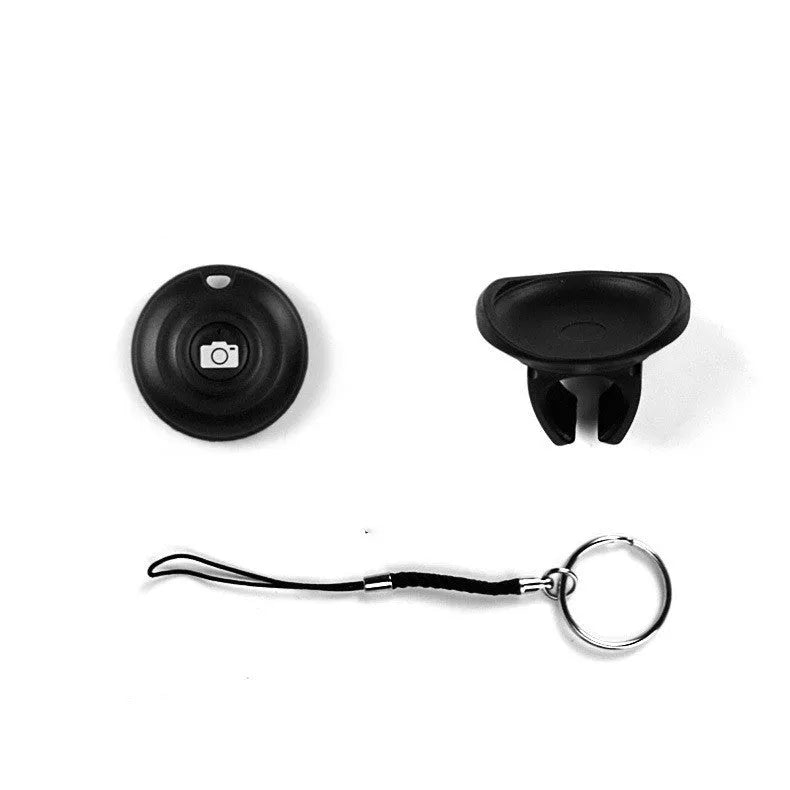Black Bluetooth selfie remote control made of PC material weighing 27g with 10m range