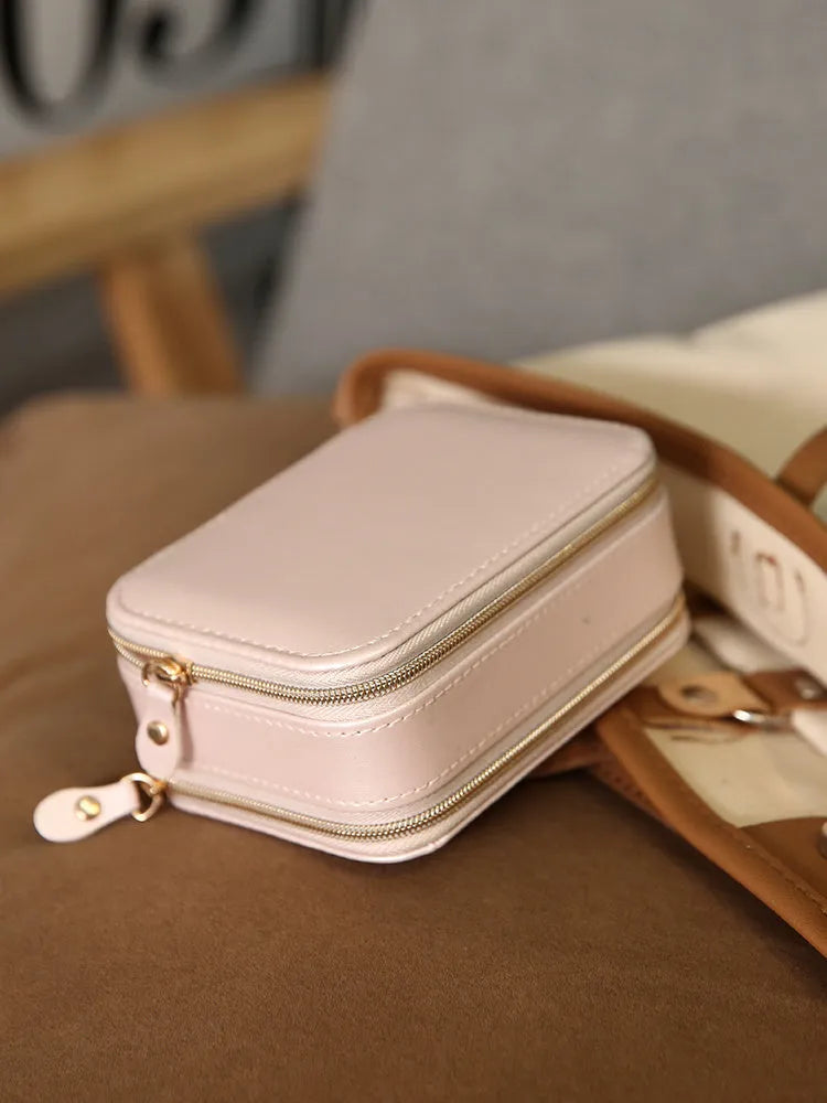 Portable double-sided travel jewellery box in blue with PU leather exterior and pearl velvet lining