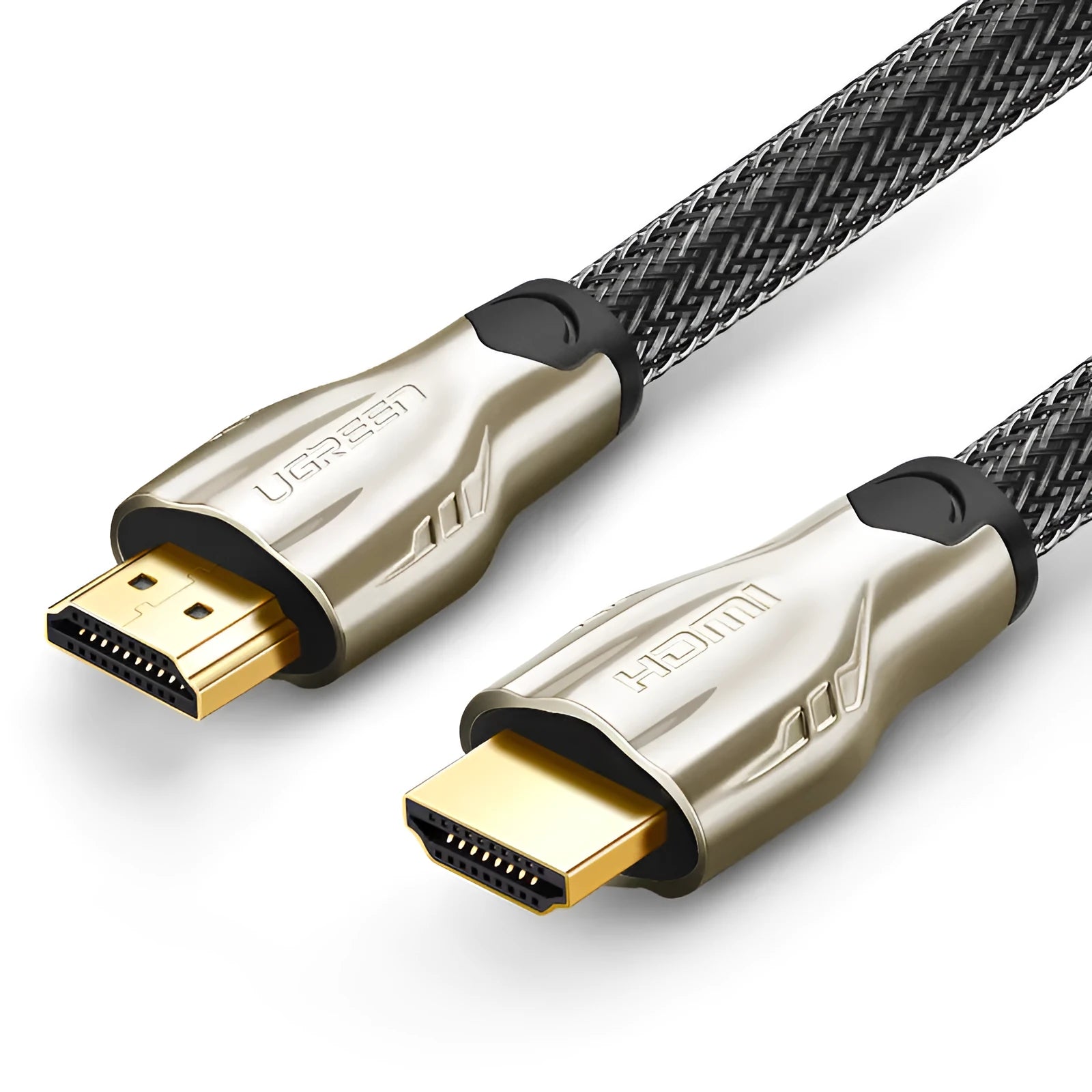Close-up of a gold-plated HDMI connector on a black cable showing its aluminium foil and braided shielding layers.