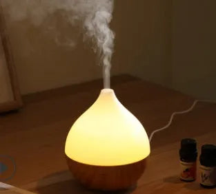 Asakusa wood grain finish vase-shaped USB aroma diffuser on a table.