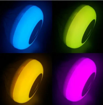 White Bluetooth speaker LED light bulb with E27 screw base and remote control.
