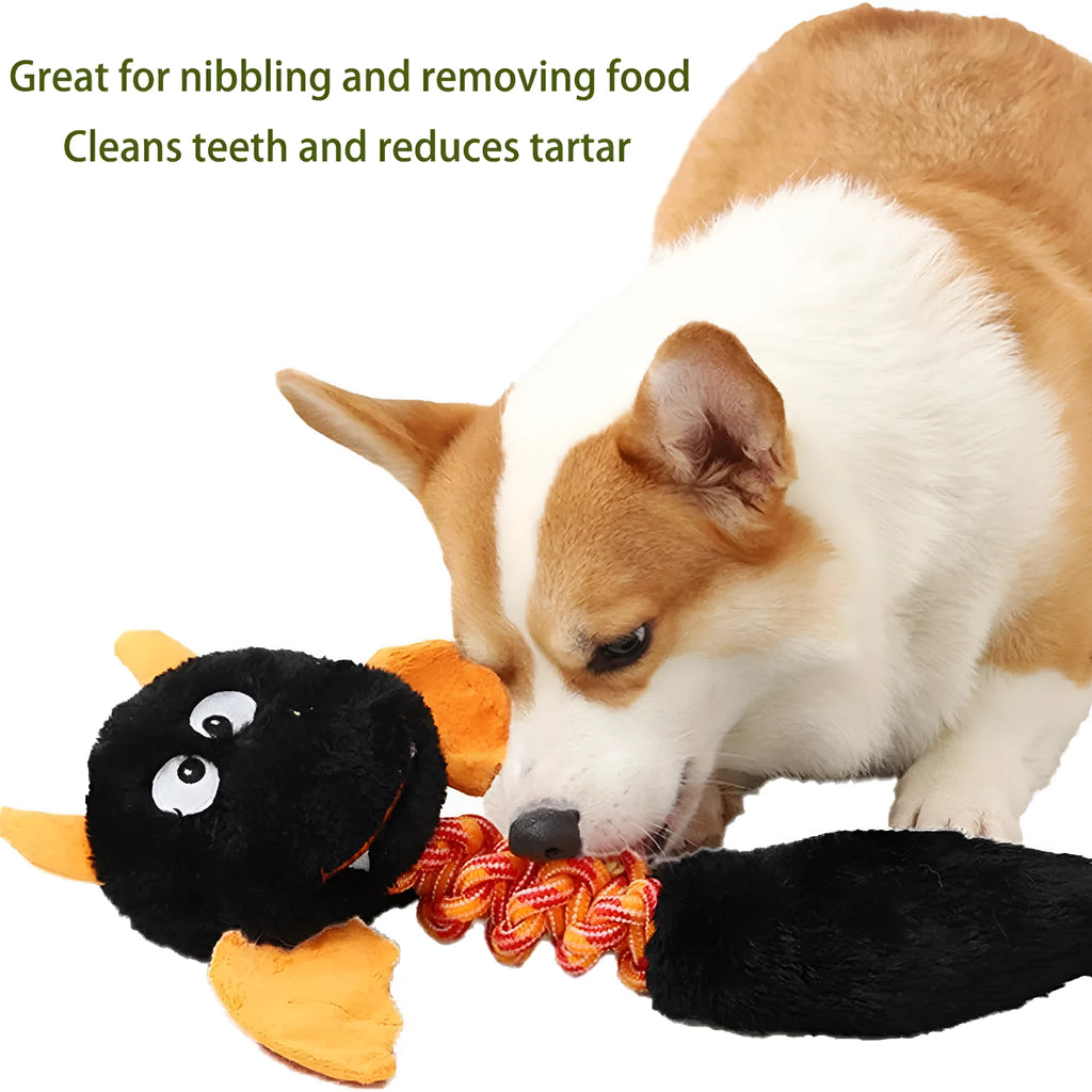 Large green plush dog toy with rope knot and cartoon design on a white background.