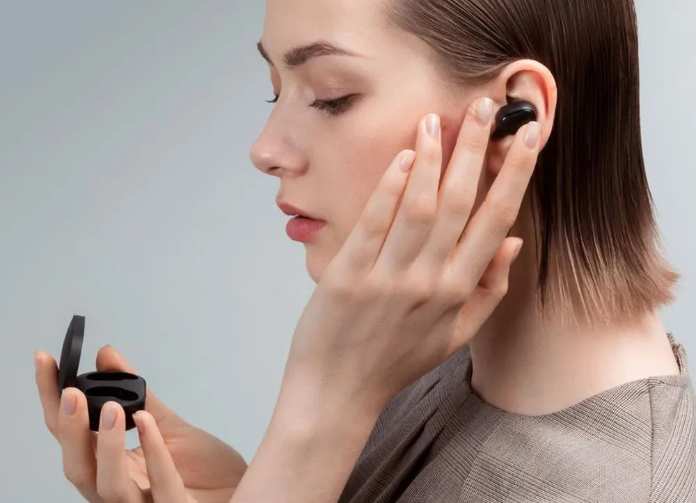 Redmi AirDots black true wireless earbuds with charging case.