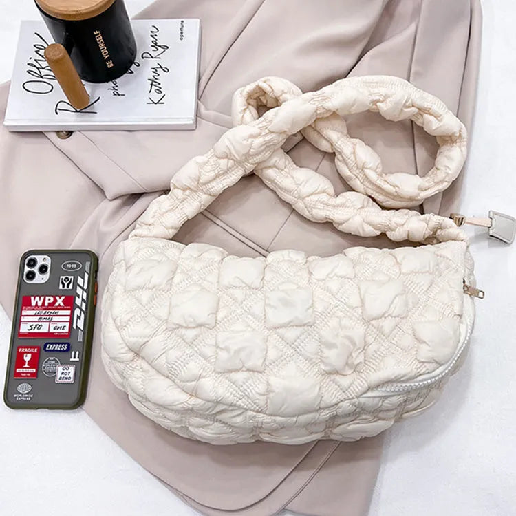 Women's lightweight nylon underarm messenger bag in a solid colour with an adjustable long shoulder strap.