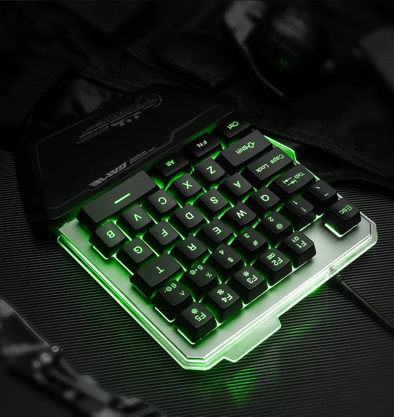 Black G40 Flow Colour one-handed mechanical keyboard with RGB backlit keys on a desk.