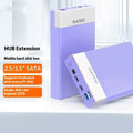 Black and silver 3.5 inch USB SATA hard drive enclosure with power supply and cable on a desk.