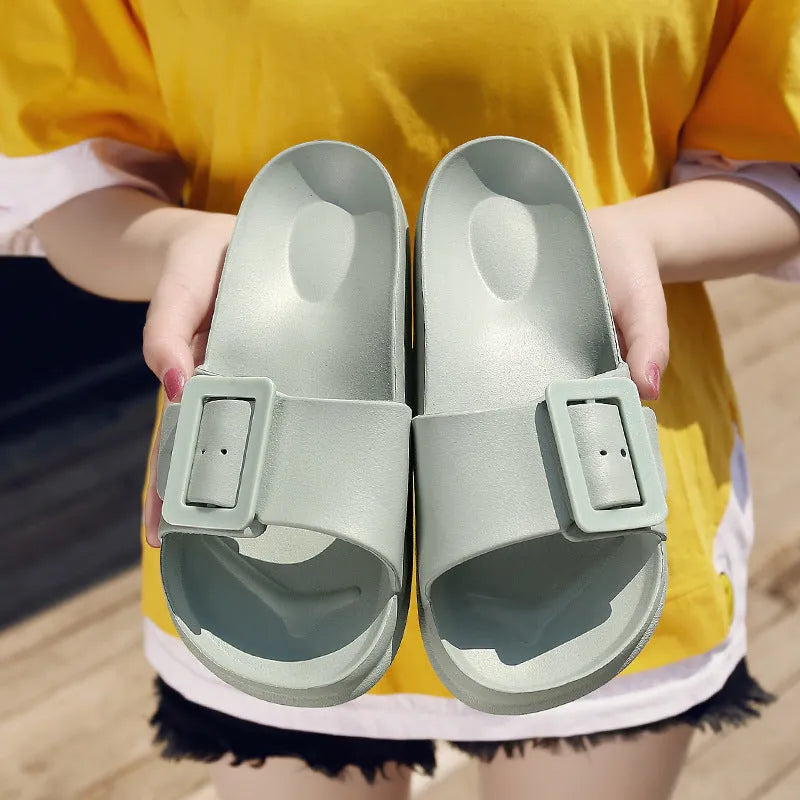 Women's EVA buckle fastening flip-flop slippers in assorted colours showing soft sole design