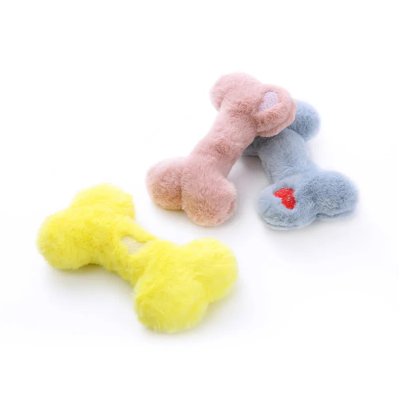 Vocal bone plush dog toy for aggressive chewers in blue, pink and yellow colours with internal squeaker