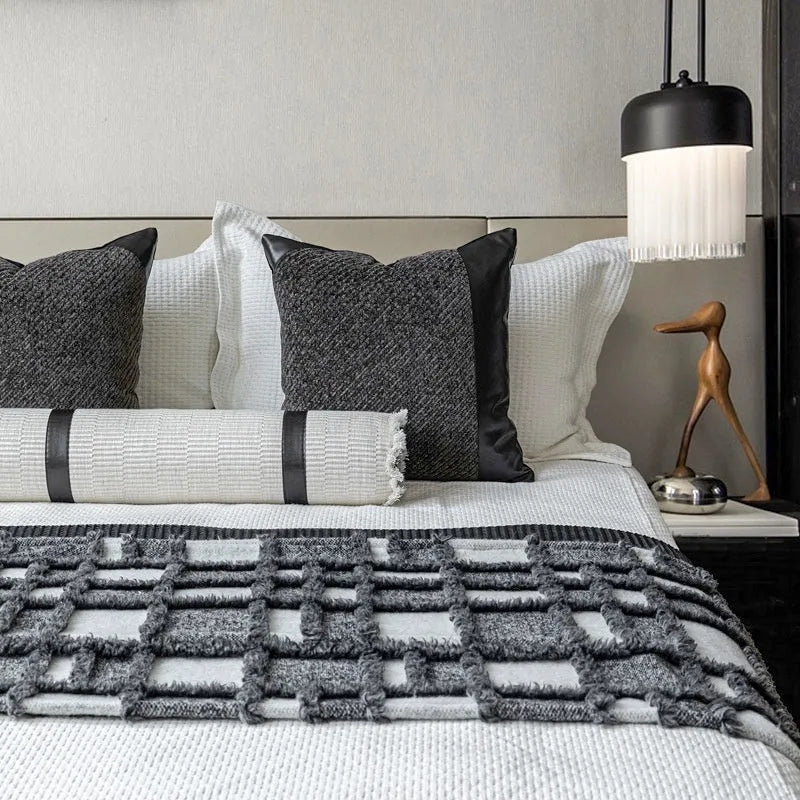 Modern minimalist grey and white plaid bed runner blanket set with leather round pillow on a 1.5m bed.