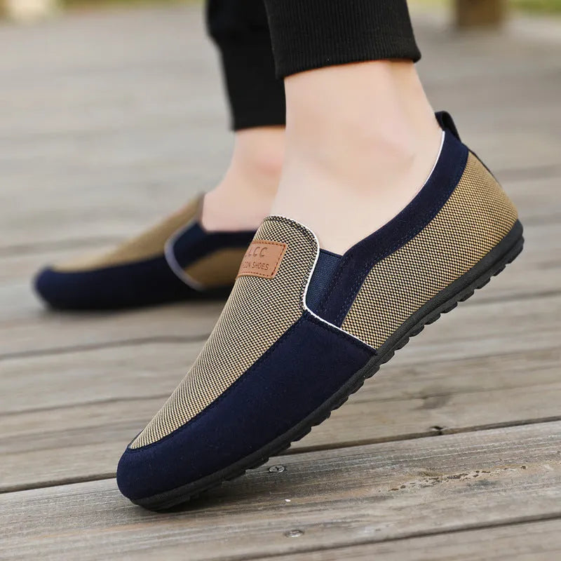 Men's grey canvas casual board shoes with round toe and rubber sole.