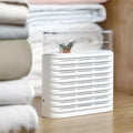 White recyclable cabinet dehumidifier with transparent cover showing colour-changing beads