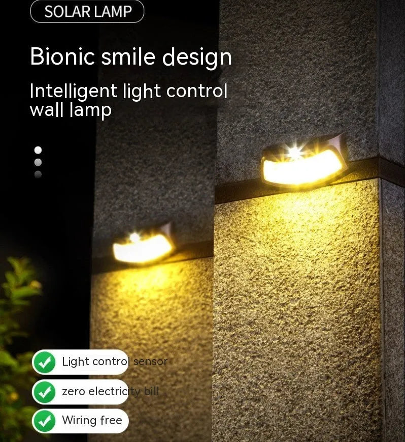 Solar outdoor smiling face wall lamp for garden decoration with IP65 waterproof rating