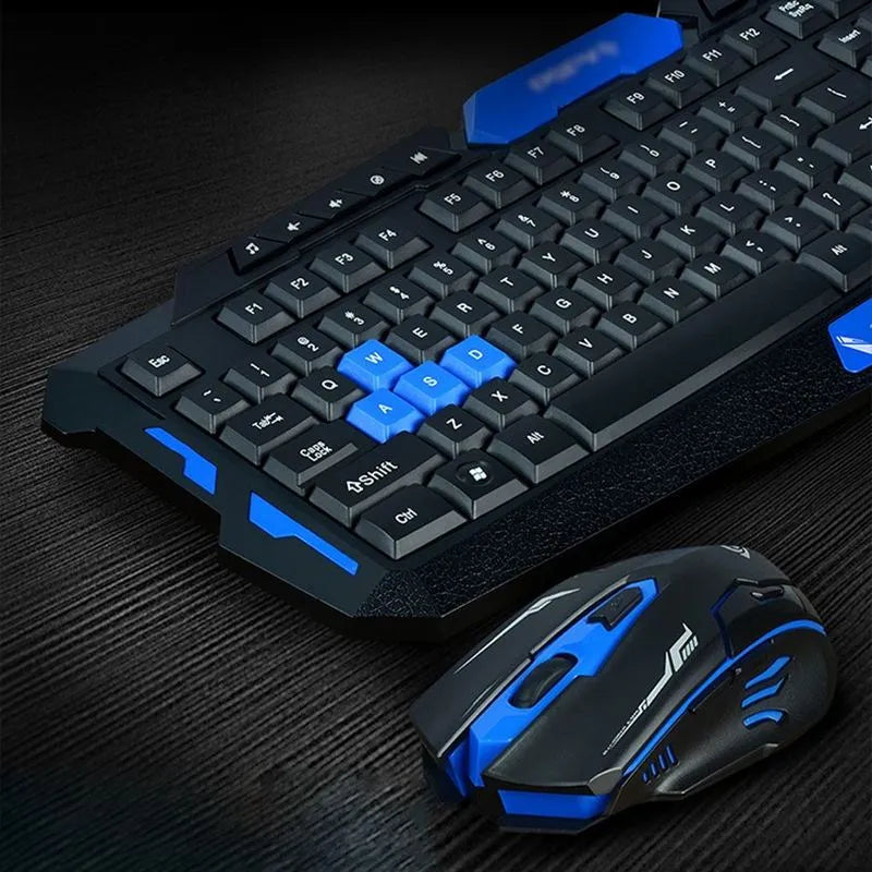 Black wireless keyboard and mouse with blue accents on desk