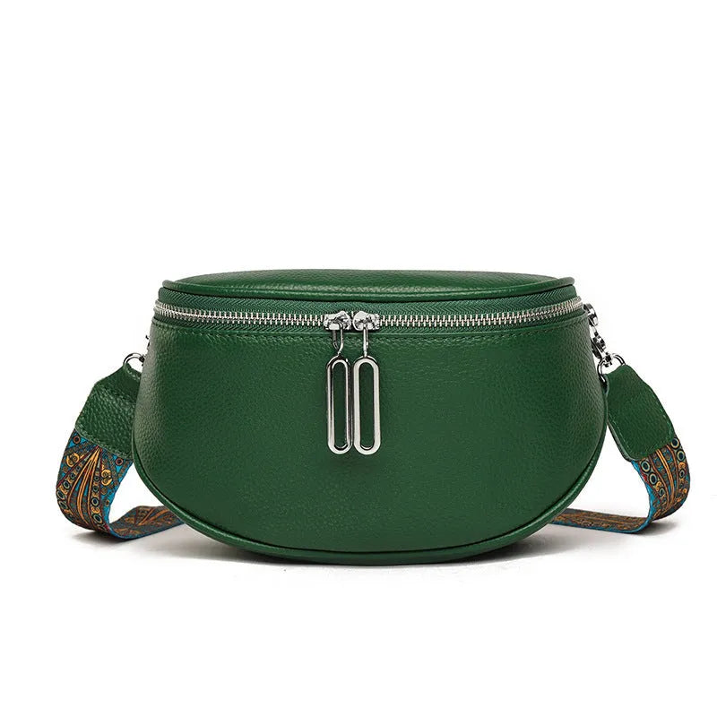 Soft black PU women's saddle-shaped messenger bag with a single crossbody strap and external pocket.