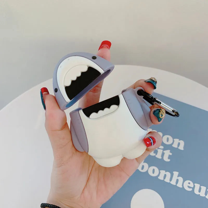 Soft silicone cover with shark fin design on a white Apple Airpods 1 wireless earbud.