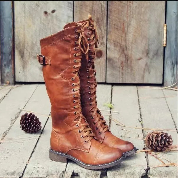 Women's black casual high-leg boots with a chunky low heel and round toe.