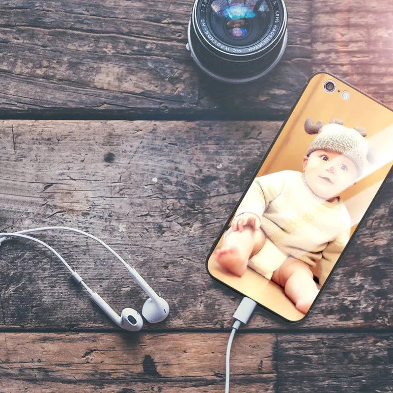 Slim hard back patterned case for iPhone with raised edge protecting camera and screen.