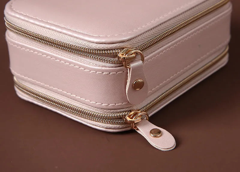 Portable double-sided travel jewellery box in blue with PU leather exterior and pearl velvet lining