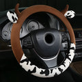 Short plush steering wheel cover with protective handle in black colour