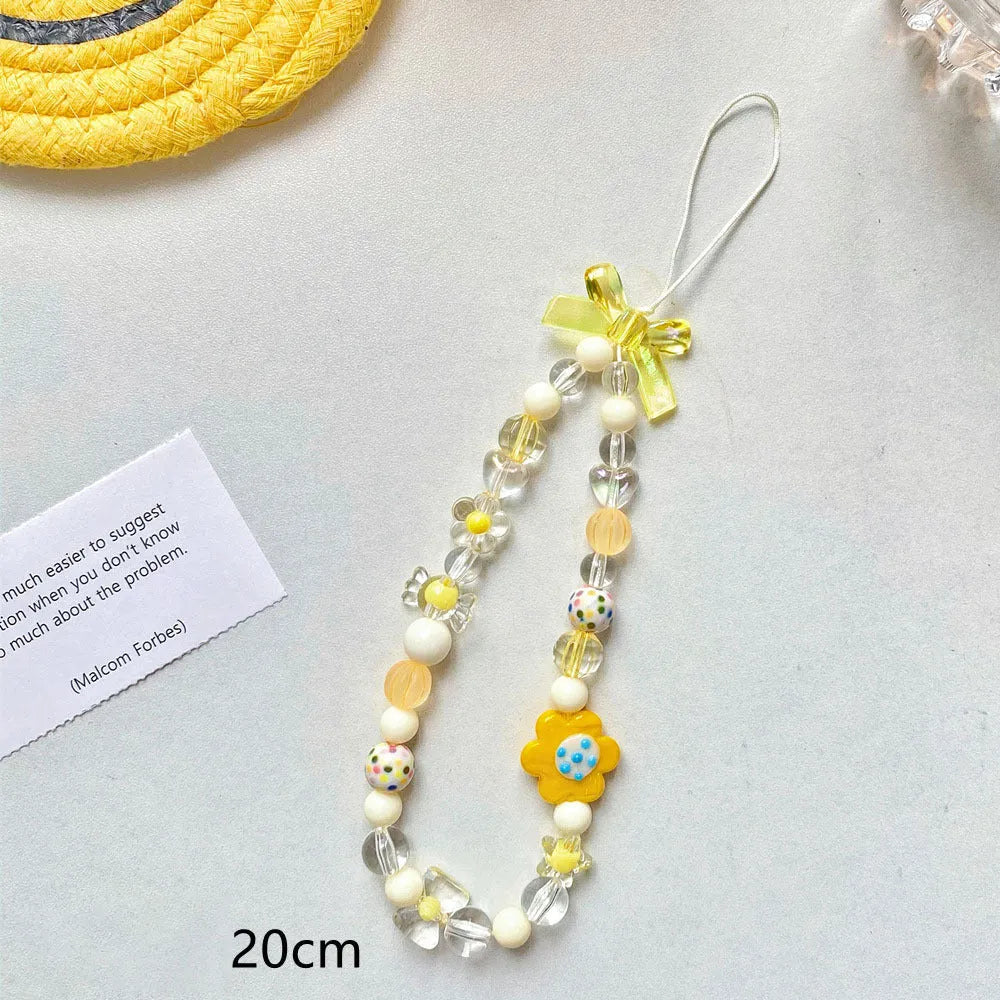 Beaded flower phone lanyard with plastic resin beads on adjustable cord in yellow, blue or pink