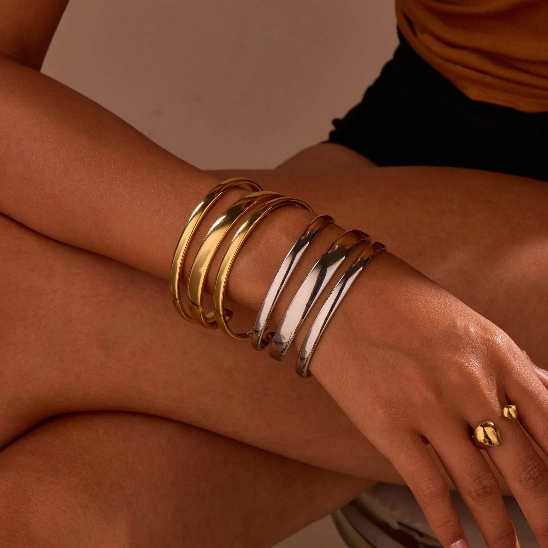 Women's stainless steel opening bracelet with geometric line design in gold or steel colour with 18K electroplated finish