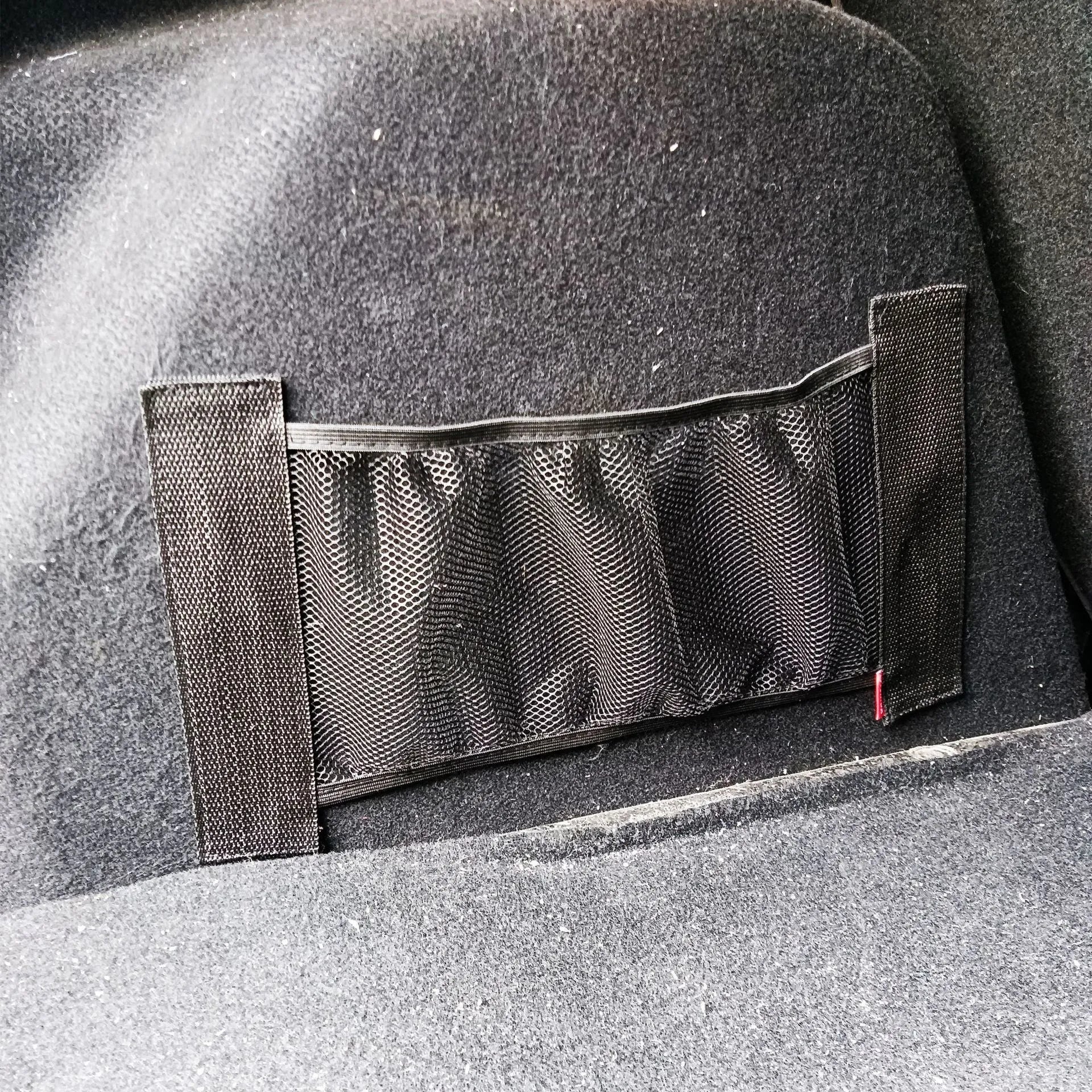 Durable polyester elastic storage net for a car boot, shown in 20x45cm size.