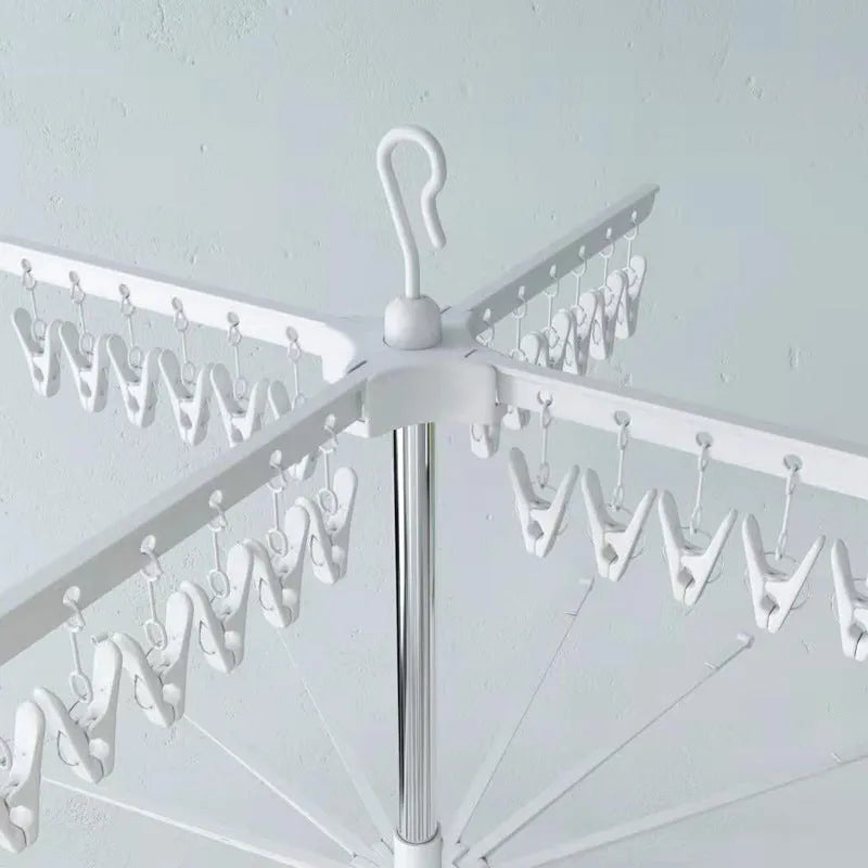 Mobile three-layer stainless steel drying rack with plastic clips for socks and ties.