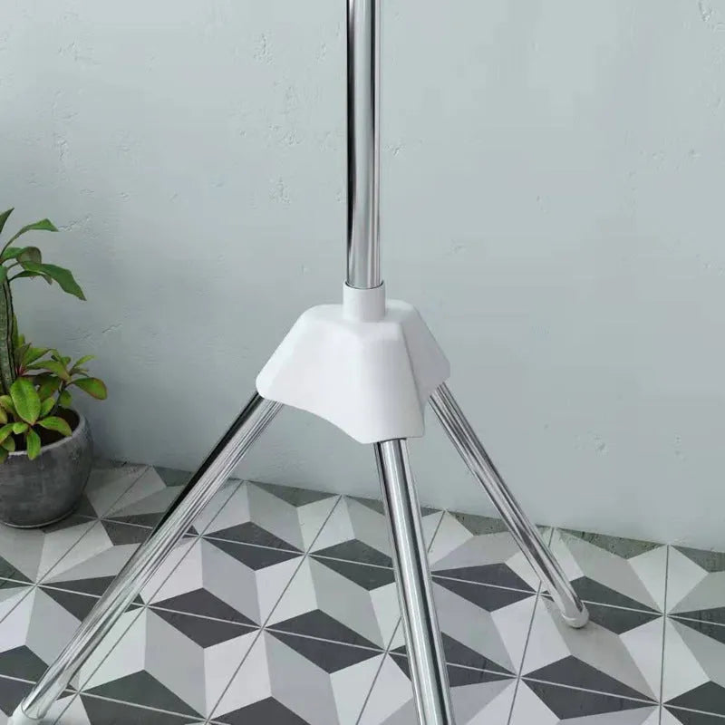 Mobile three-layer stainless steel drying rack with plastic clips for socks and ties.