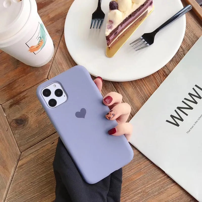 A solid colour silicone phone case for an iPhone, shown in one of six available colour options.