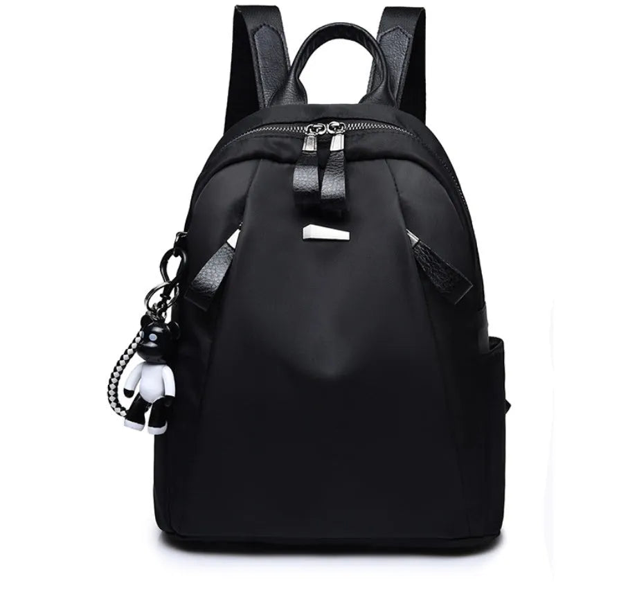 Medium-sized wine red Oxford cloth rucksack with double shoulder straps and a front digging bag.