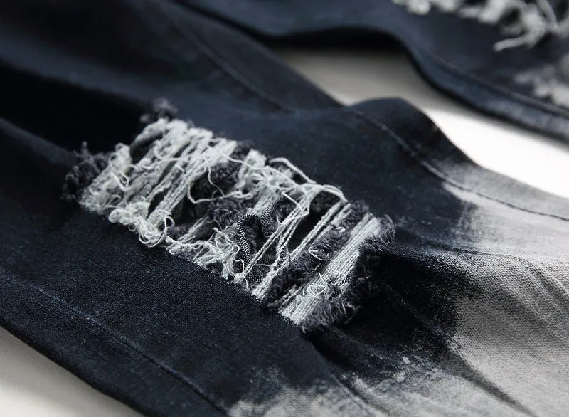 Men's blue and white faded cotton denim jeans with distressed worn finish, straight leg style