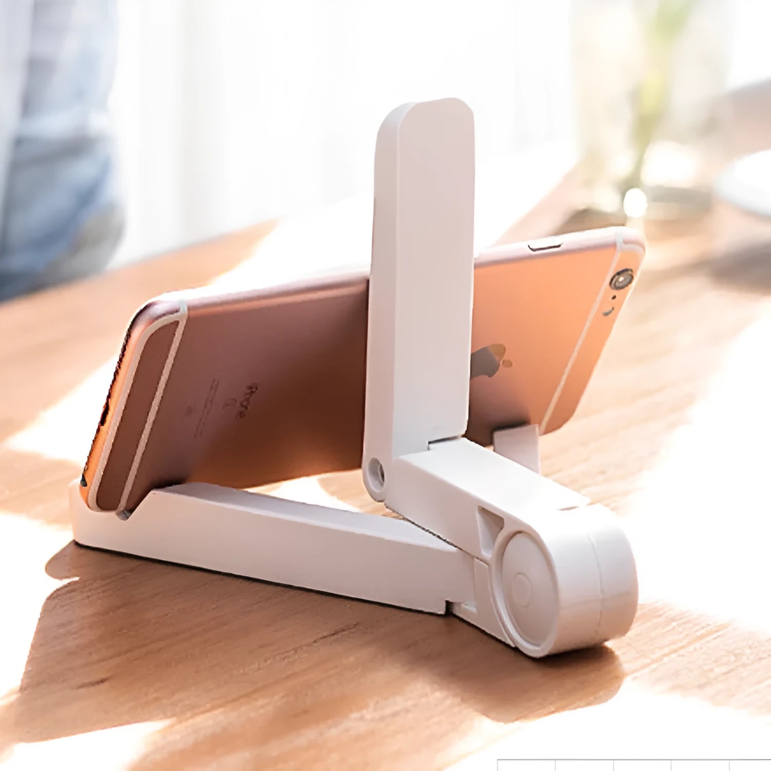 Foldable tablet holder in black showing adjustable angle stand for phone or tablet