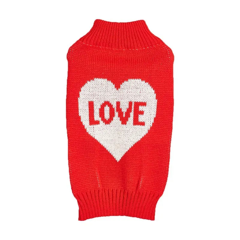 Red love heart design dog sweater on a small dog, showing pink bow detail.